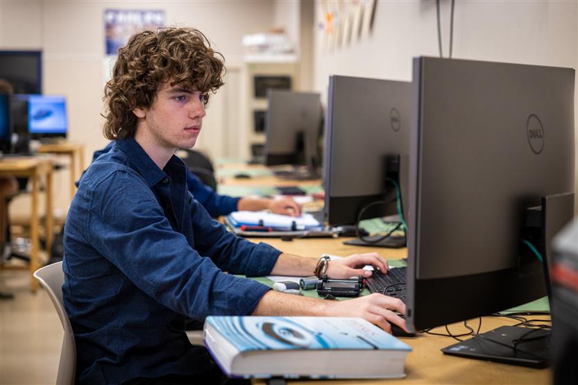 Students work in an architecture and design class